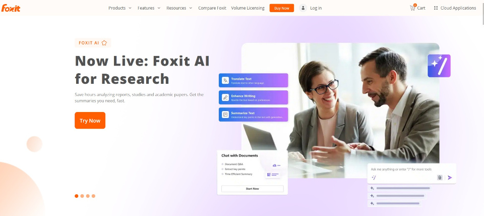 A man and a woman in business suits sit in front of a laptop talking on the Foxit homepage.